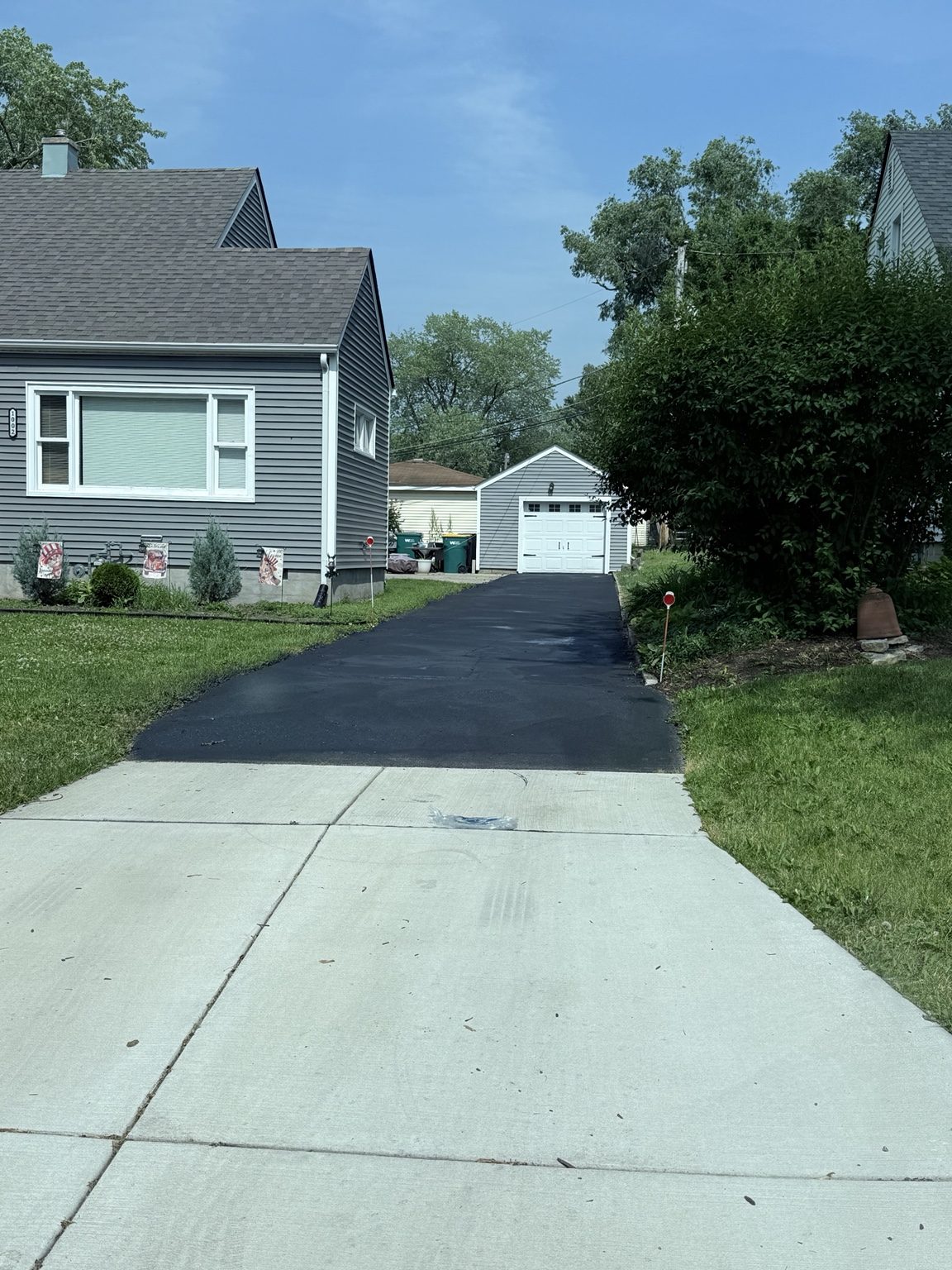 Residential driveway sealcoating
