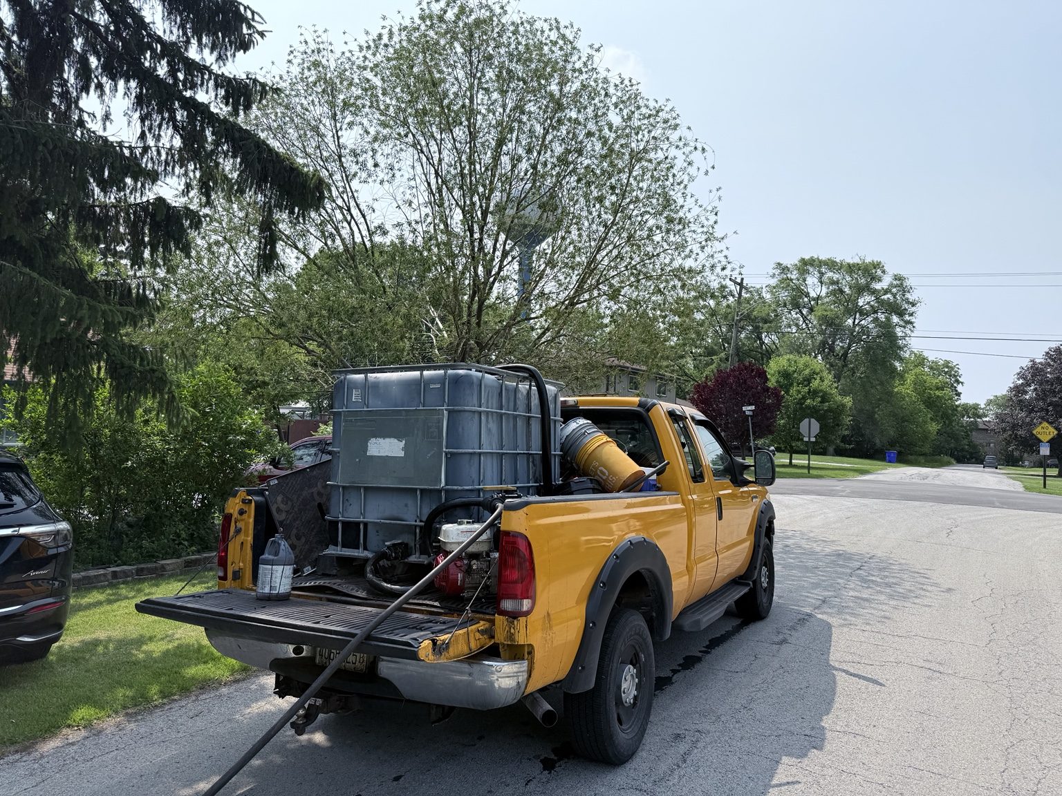 Residential driveway sealcoating