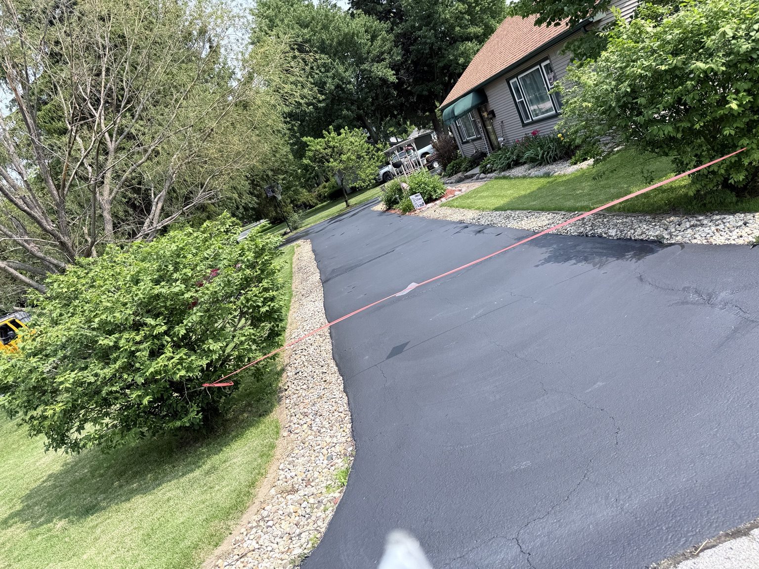 Residential driveway sealcoating