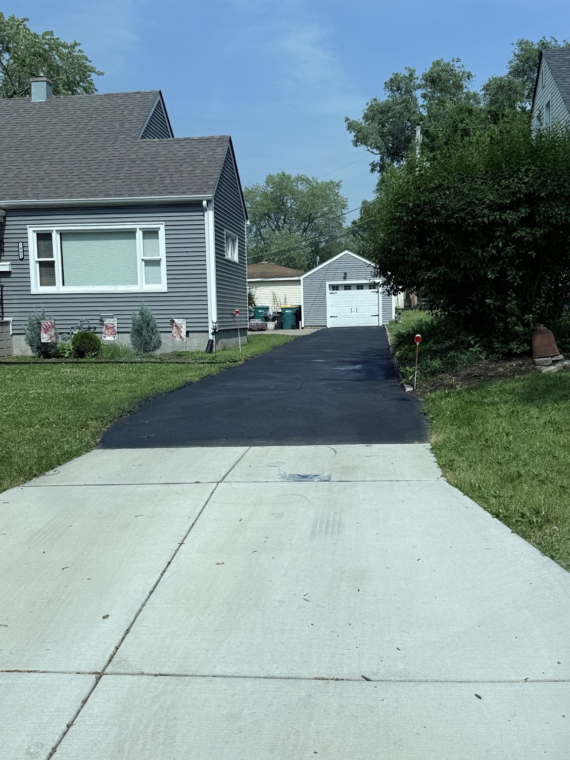 Residential driveway sealcoating
