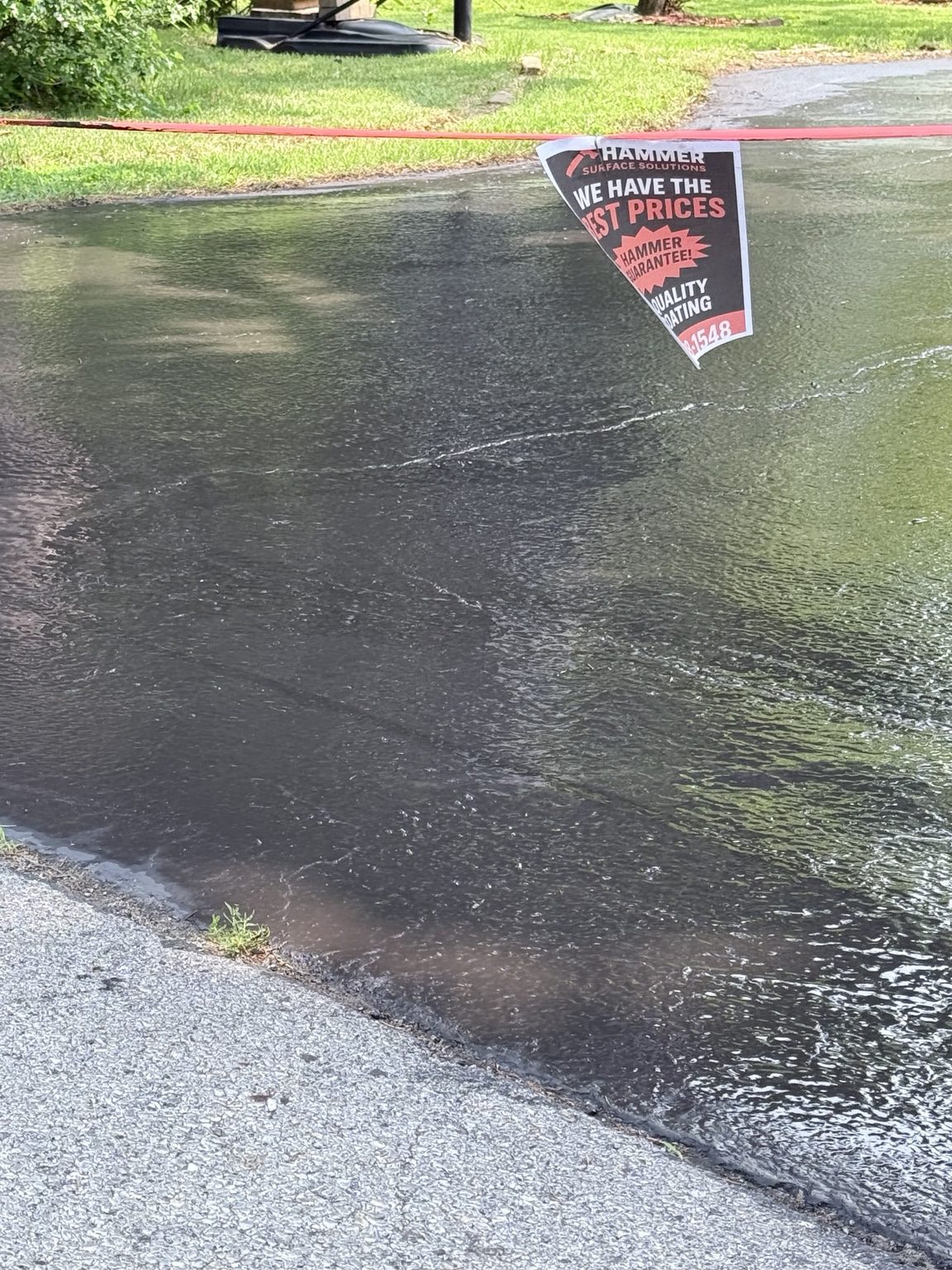 Residential driveway sealcoating