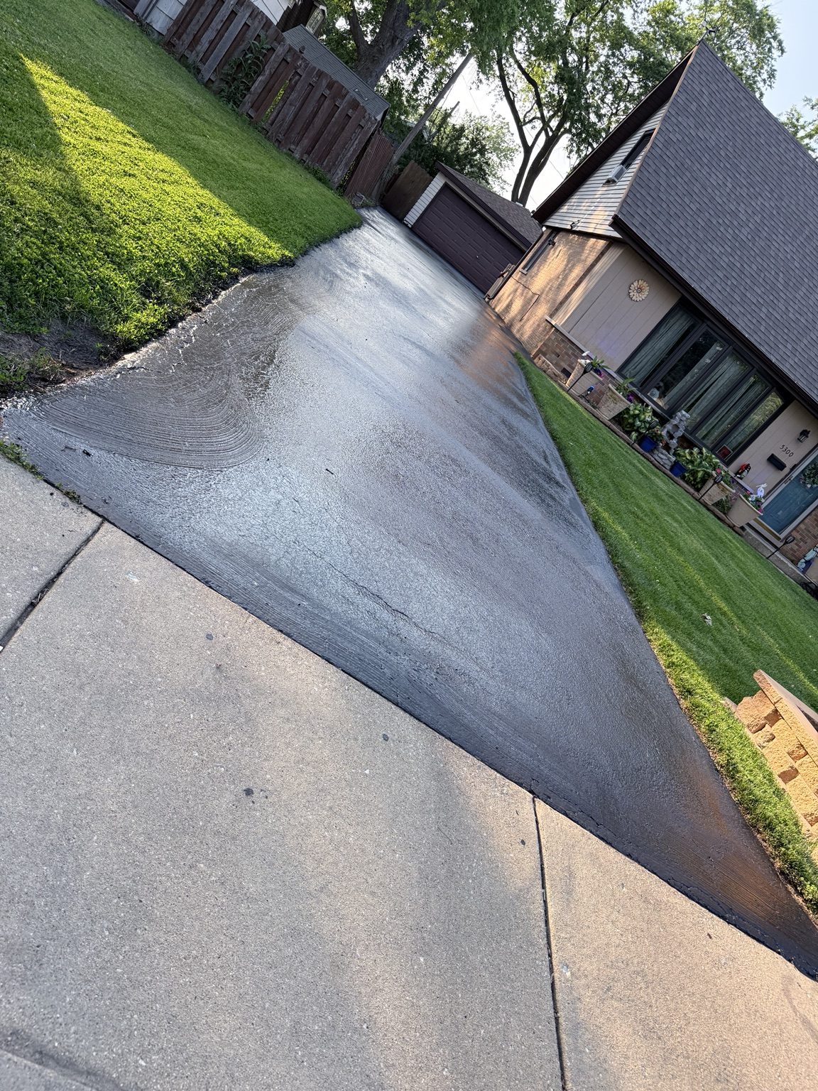 Residential driveway sealcoating
