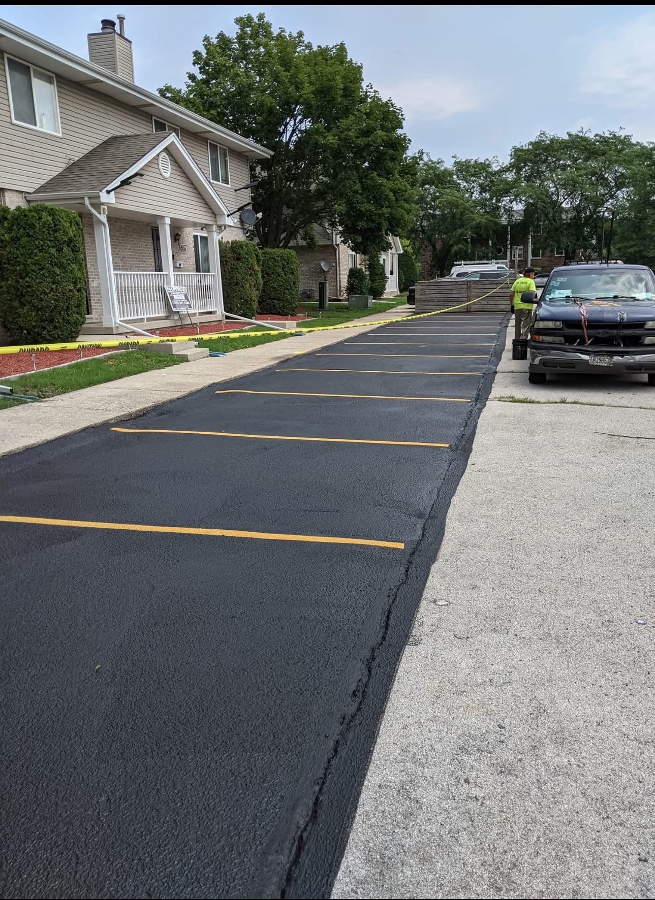 Residential driveway sealcoating